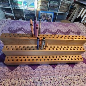 Crayon, pencil, paintbrush, jewelry tool holder.